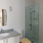 Three-Bedroom Suan Tua Apartment Layan-master bathroom with glass shower